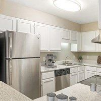 Kitchen with a refrigerator